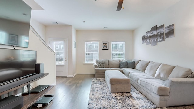 living room featuring ceiling fan and hardwood / wood-style floors