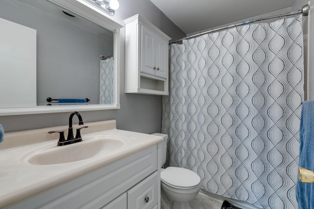 bathroom featuring a shower with curtain, vanity, and toilet