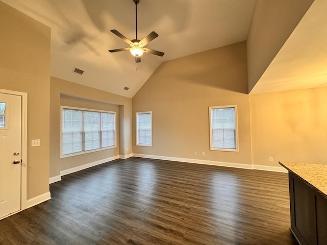 unfurnished living room with ceiling fan, dark hardwood / wood-style flooring, and lofted ceiling