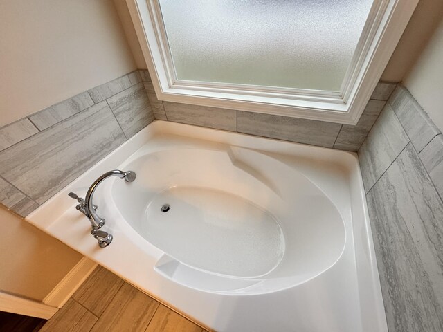 bathroom with a tub