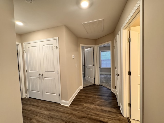 corridor featuring dark hardwood / wood-style floors