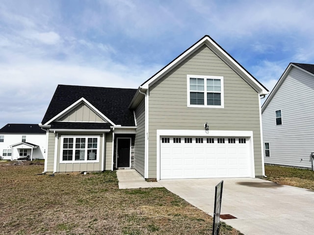 traditional home with driveway, an attached garage, board and batten siding, and roof with shingles