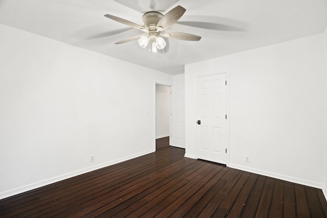 empty room with ceiling fan, baseboards, and dark wood finished floors