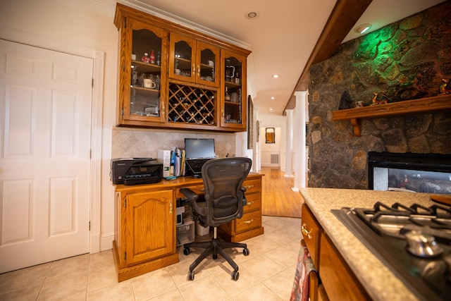 tiled office space with a fireplace