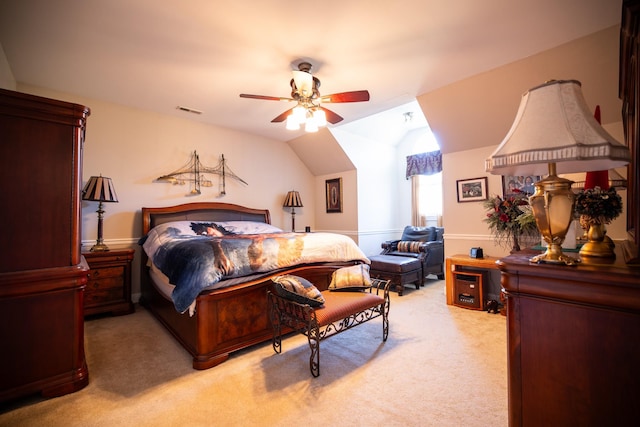 bedroom with carpet, ceiling fan, and vaulted ceiling