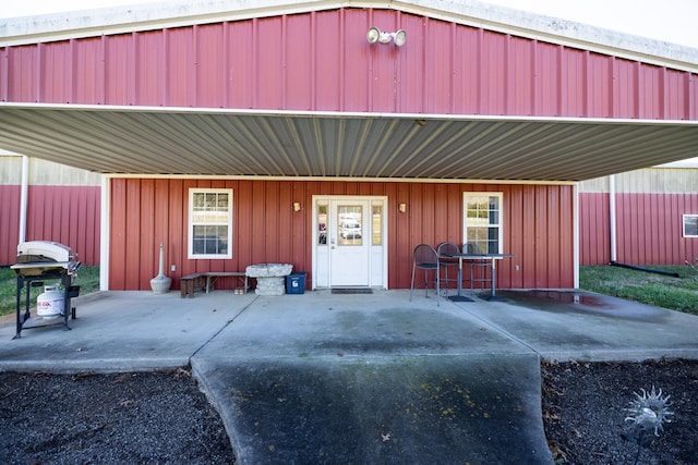 doorway to property with a carport