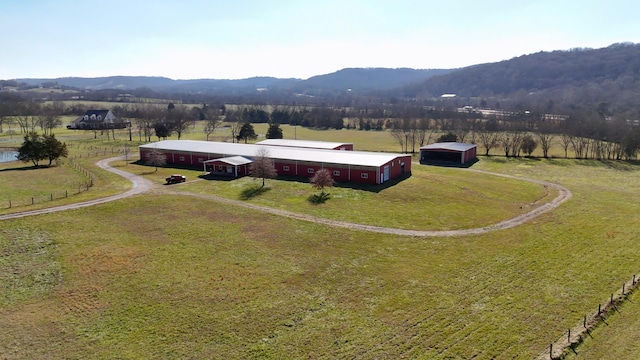 drone / aerial view featuring a mountain view and a rural view