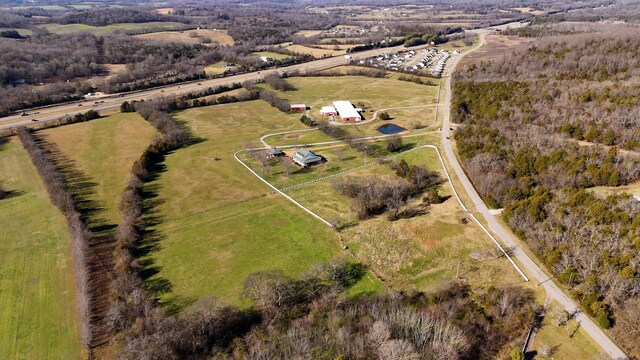 birds eye view of property with a rural view