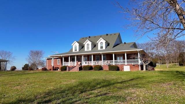 view of front of property with a front yard and a porch