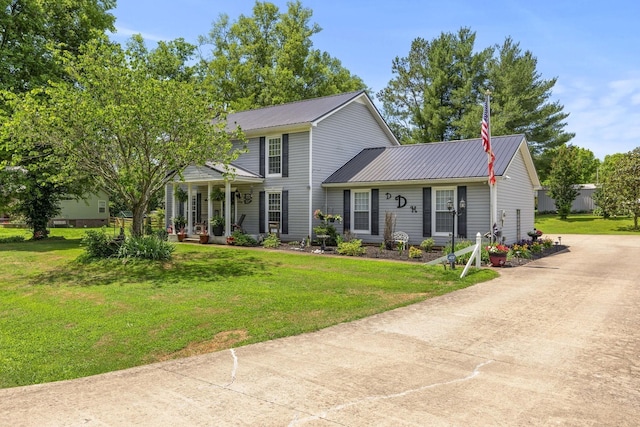 view of front of home with a porch and a front lawn