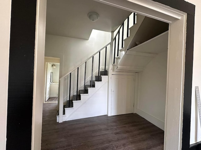 stairway featuring hardwood / wood-style flooring