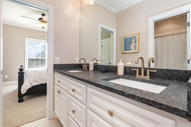 bathroom featuring tile patterned flooring, vanity, ceiling fan, and ornamental molding