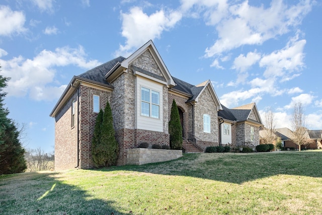 view of side of property with a lawn