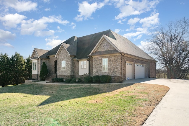 view of front of house featuring a front yard and a garage