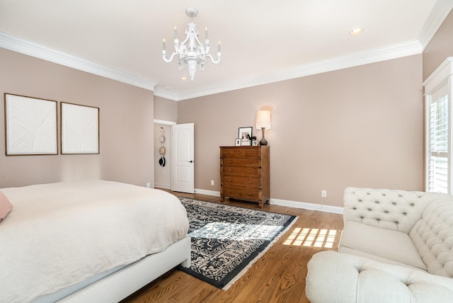 bedroom with hardwood / wood-style floors, an inviting chandelier, and ornamental molding