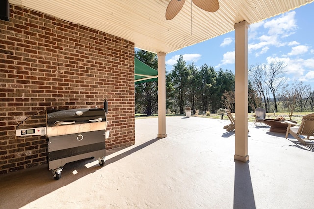 view of patio / terrace featuring ceiling fan and grilling area