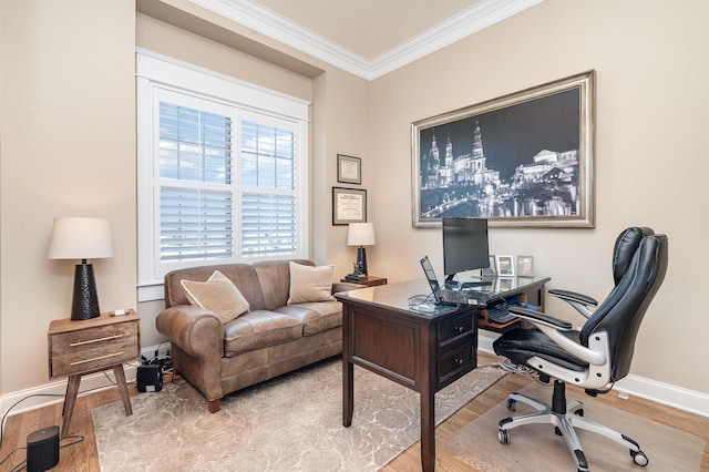 office area with light hardwood / wood-style floors and ornamental molding