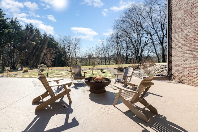 view of patio / terrace with a fire pit