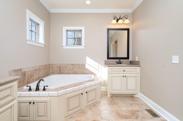 bathroom with vanity, a bathtub, and ornamental molding