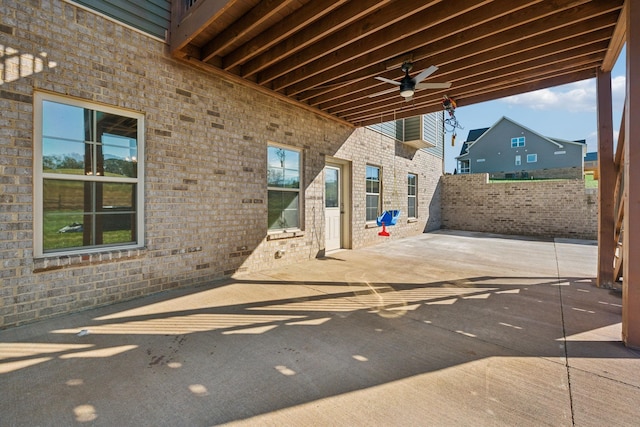 view of patio featuring ceiling fan