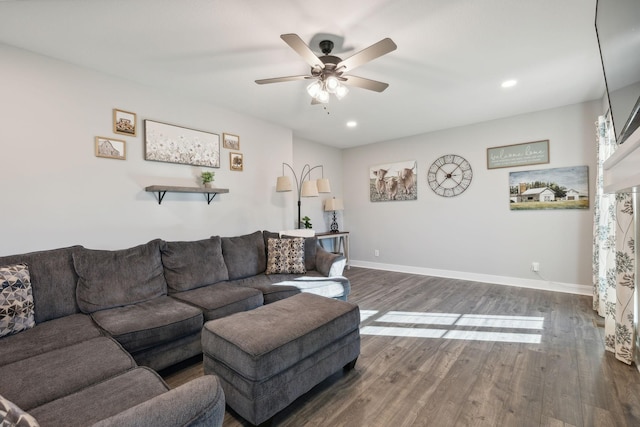 living room with dark hardwood / wood-style floors and ceiling fan