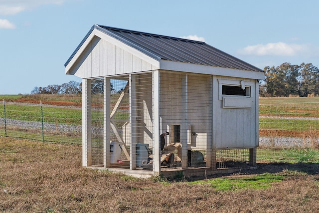 view of outdoor structure featuring a rural view