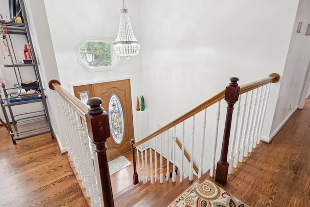 foyer with a chandelier and hardwood / wood-style flooring