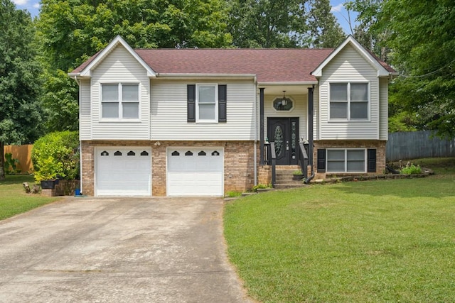 bi-level home with a front yard and a garage