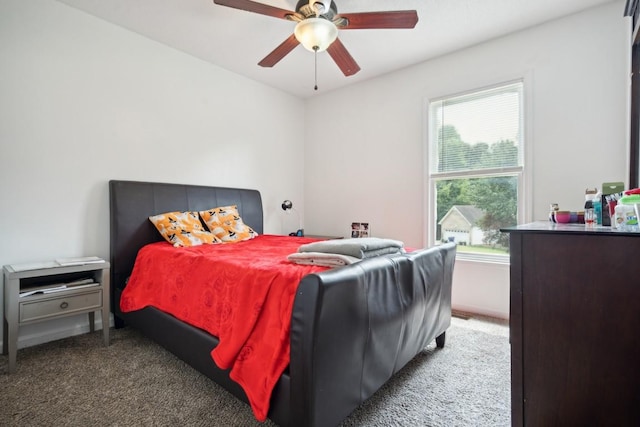 bedroom featuring carpet flooring, multiple windows, and ceiling fan