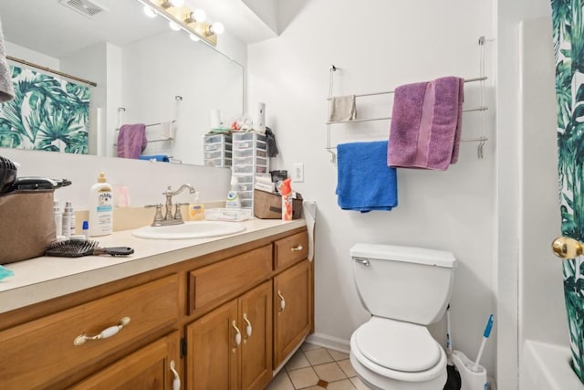 full bathroom featuring tile patterned floors, vanity, toilet, and shower / tub combo with curtain