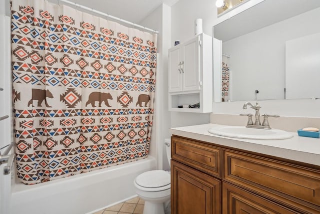 bathroom featuring tile patterned floors, vanity, and toilet