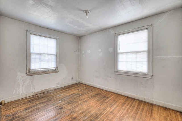 spare room featuring dark hardwood / wood-style flooring