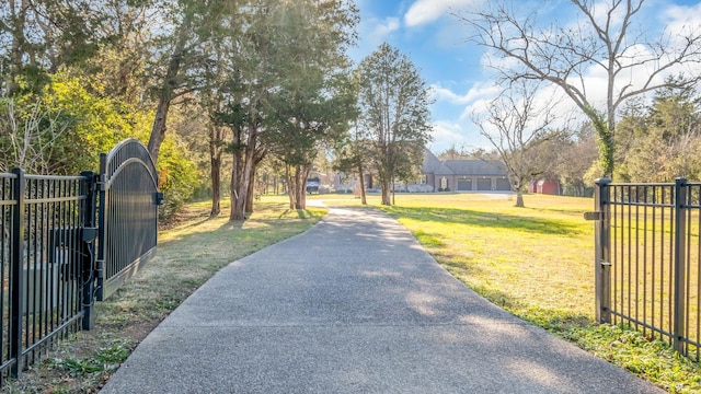 view of gate featuring a yard