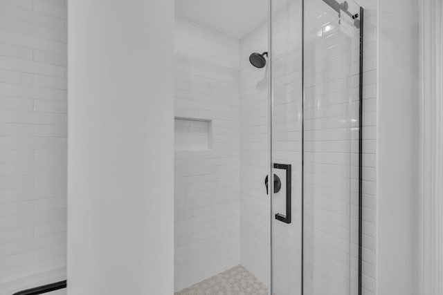 interior details with an enclosed shower