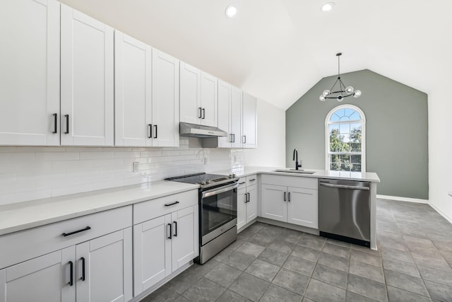 kitchen with stainless steel appliances, sink, decorative light fixtures, white cabinets, and lofted ceiling