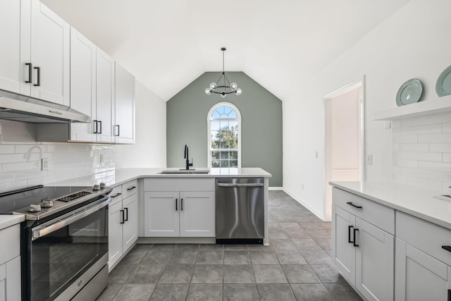 kitchen featuring white cabinets, sink, appliances with stainless steel finishes, and vaulted ceiling