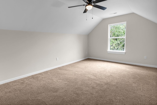 bonus room featuring ceiling fan, carpet, and vaulted ceiling