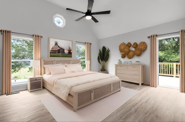 bedroom featuring access to exterior, ceiling fan, high vaulted ceiling, and light wood-type flooring