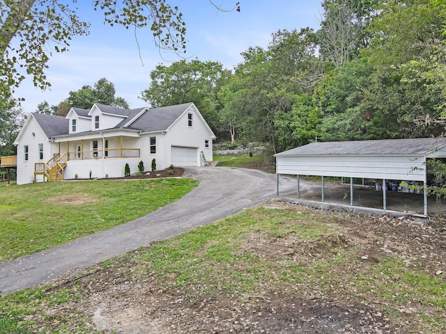 view of property exterior with a yard, covered porch, a garage, and a carport