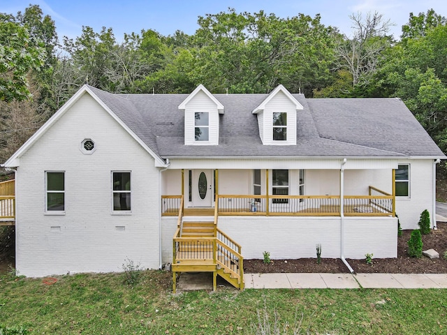 view of front of home with a front lawn and covered porch