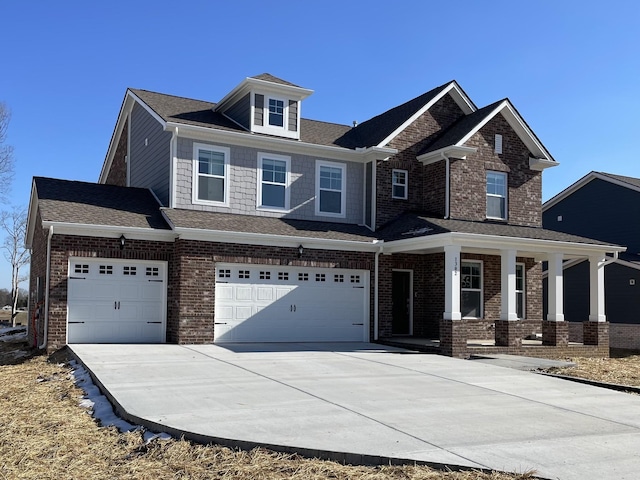 craftsman inspired home with a porch and a garage