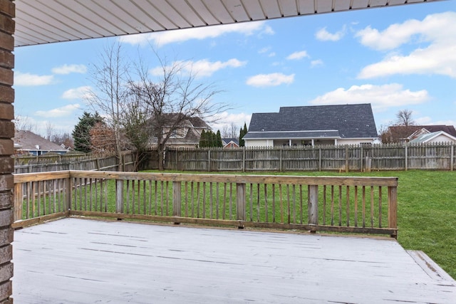 wooden terrace with a lawn