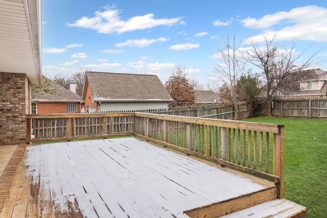 wooden deck with a lawn