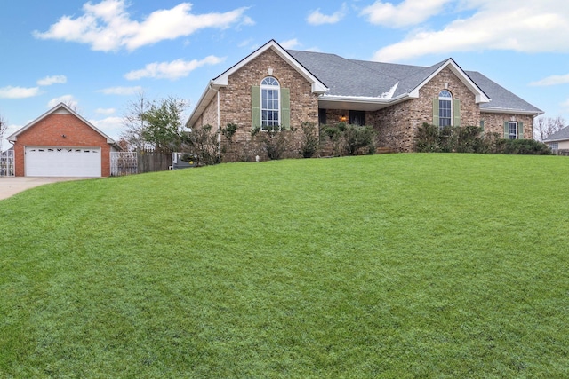 view of front of house featuring a garage and a front lawn