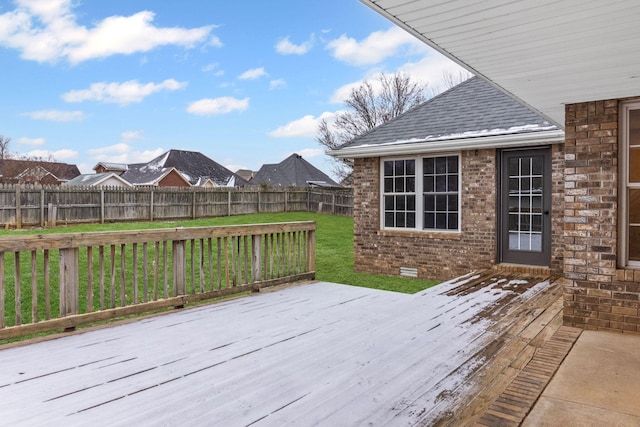 wooden terrace with a yard