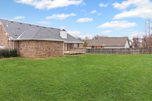 view of yard with a deck