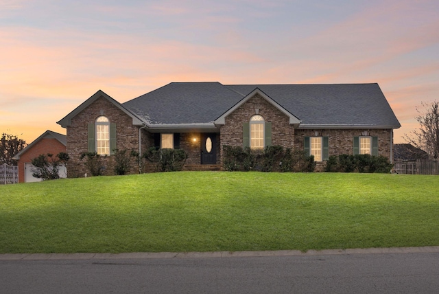 view of front of home with a lawn