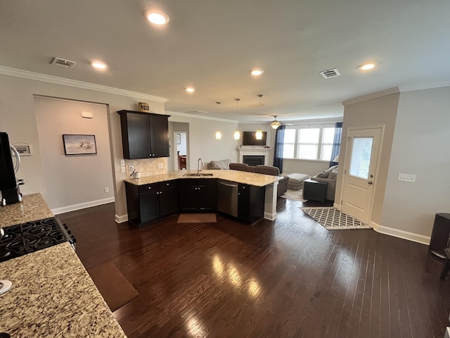 kitchen featuring sink, stainless steel dishwasher, ceiling fan, tasteful backsplash, and light stone counters