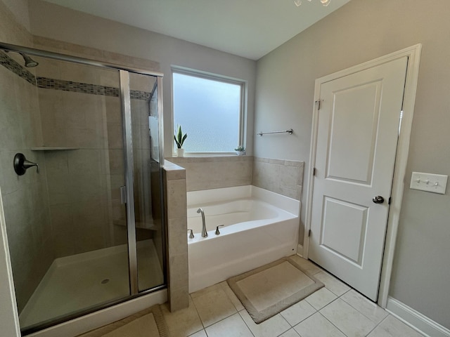 bathroom featuring tile patterned floors and independent shower and bath