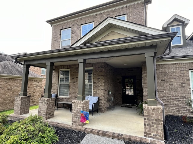 doorway to property with a porch